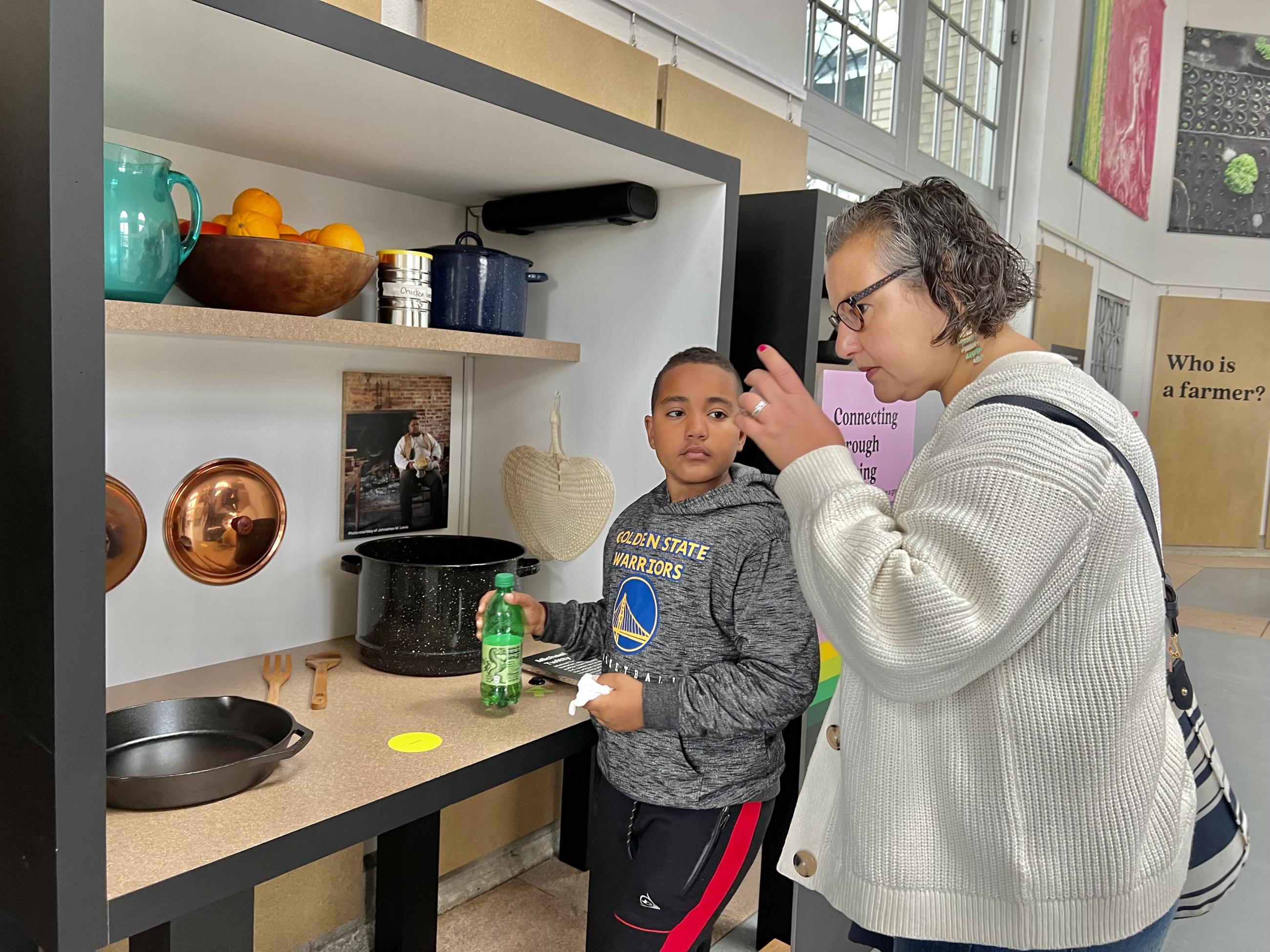 Visitors smell foods in a cooking display of Cultivate exhibit