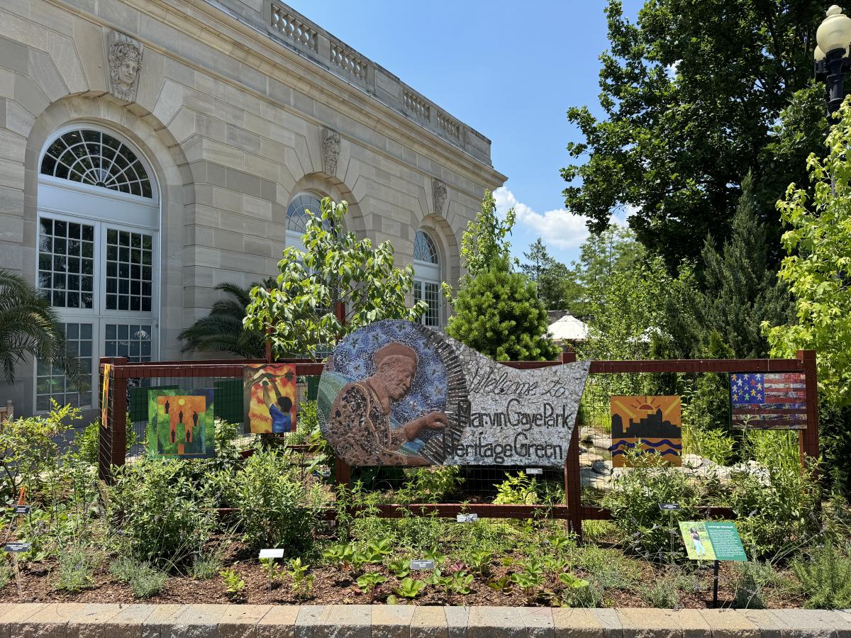 Marvin Gaye Greening Center sign surrounded by small plants